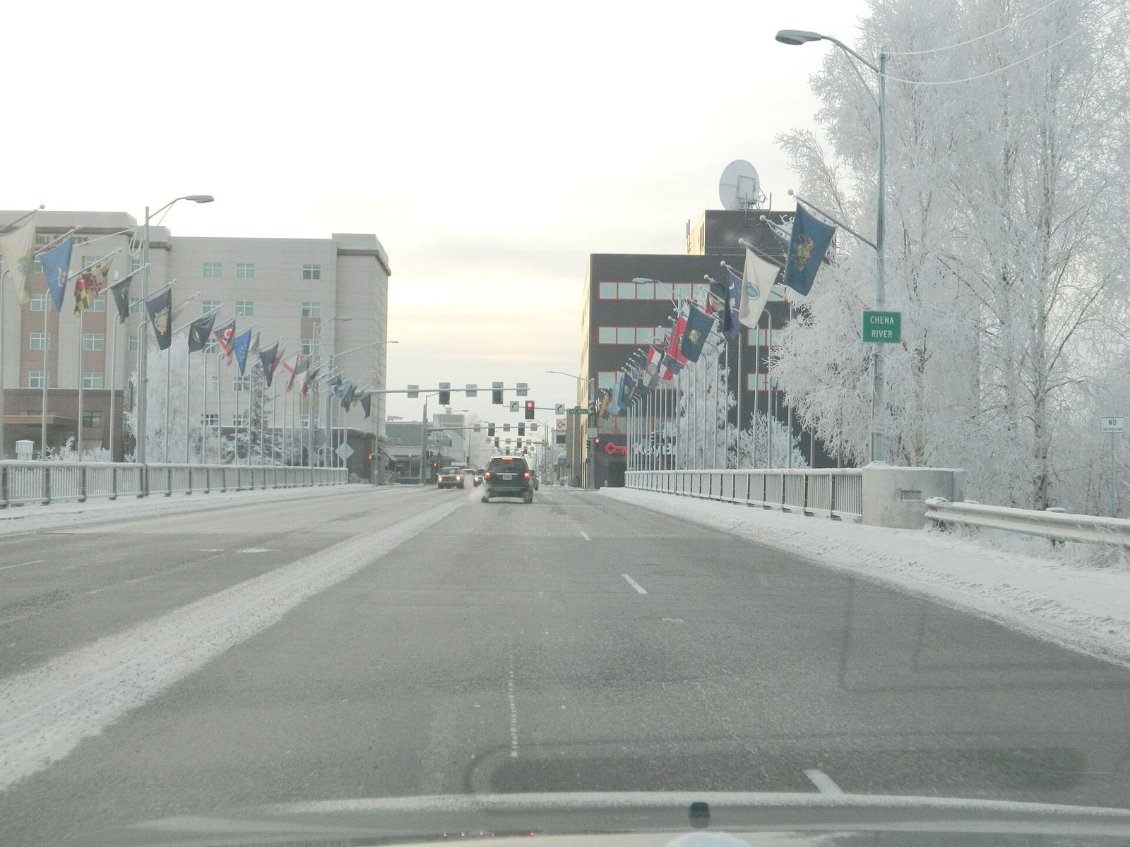 Looking south across the Cushman Street bridge over the Chena River into downtown Fairbanks, with frost on the trees