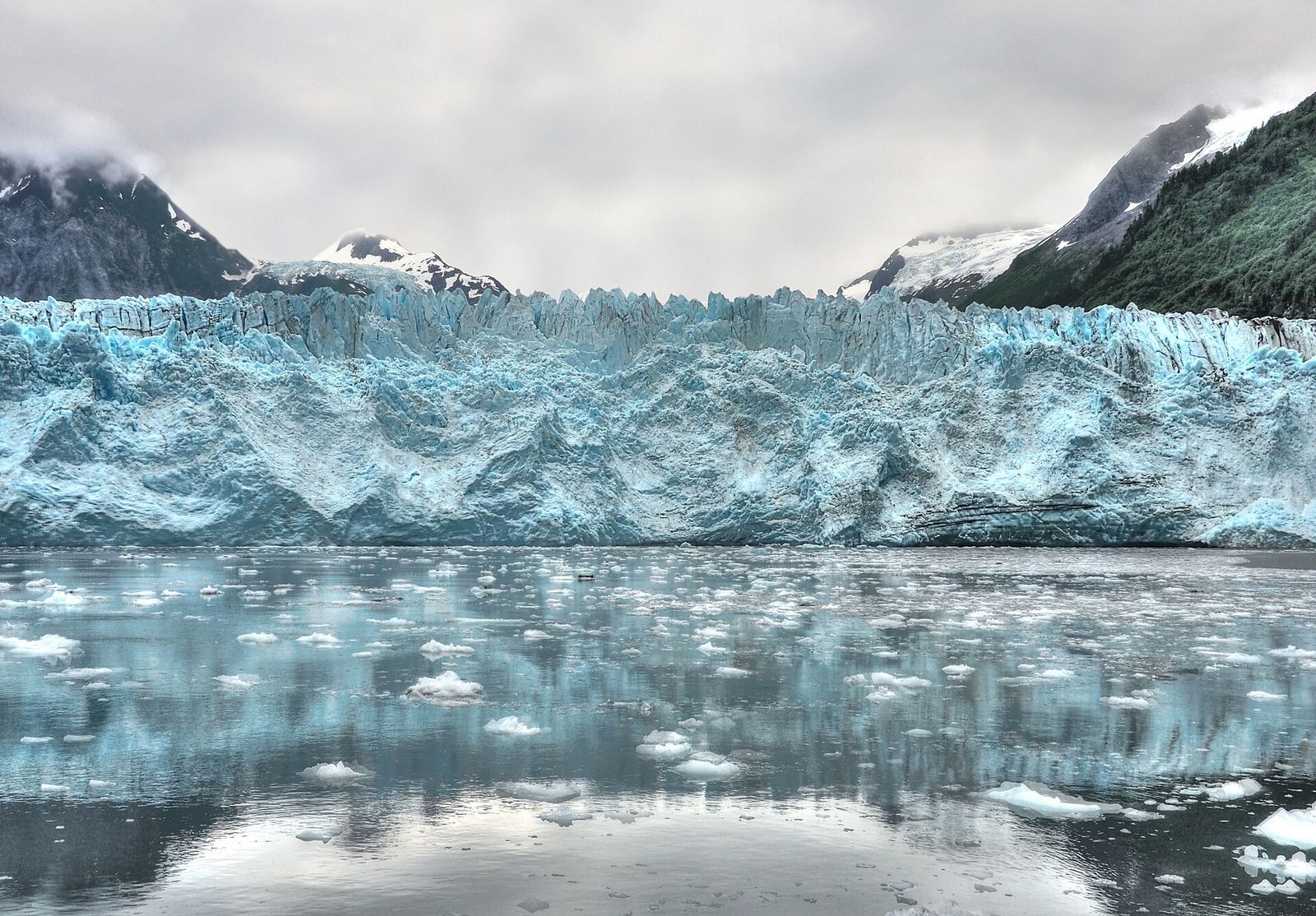 The ice face of Meares Glacier above floating ice in Prince William Sound near Valdez