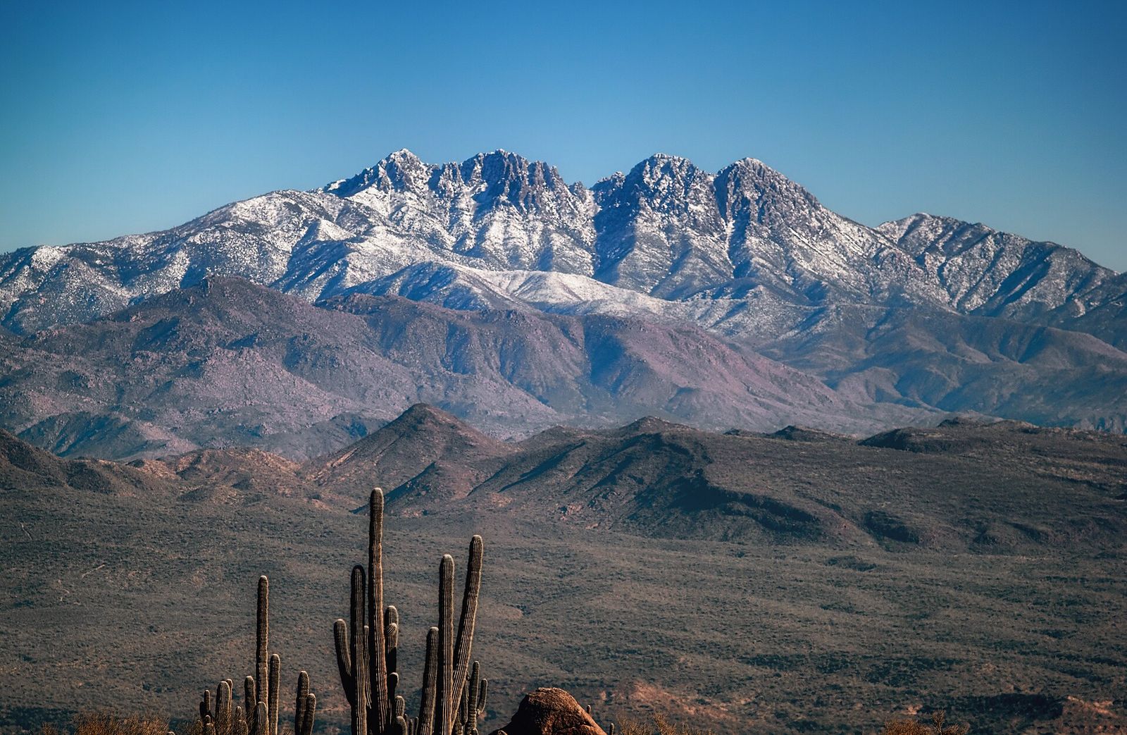 The Four Peaks dusted with snow, seen across the desert from the McDowell Sonoran Preserve in Scottsdale