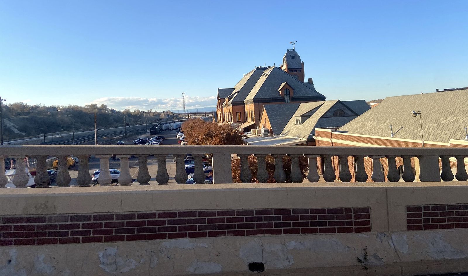 The red stone Pueblo Union Depot and its tower seen from the South Union Avenue bridge
