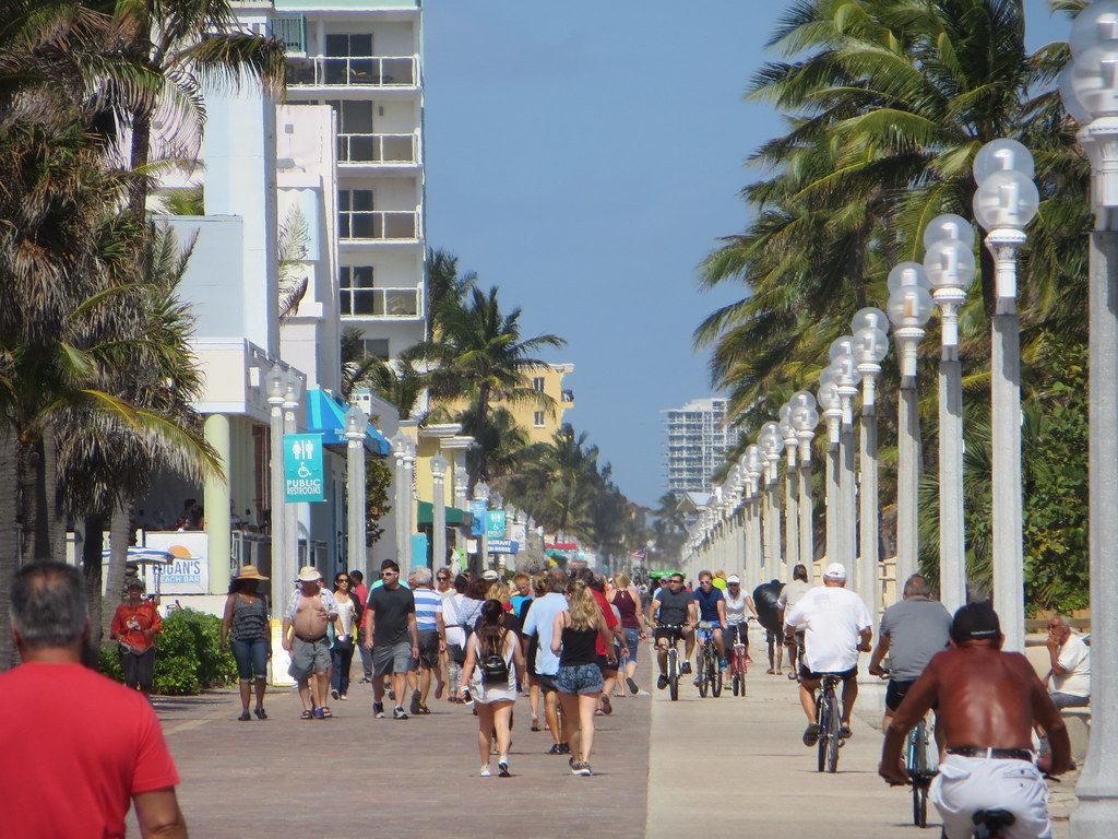 People walking and cycling on a busy day on the Hollywood Broadwalk
