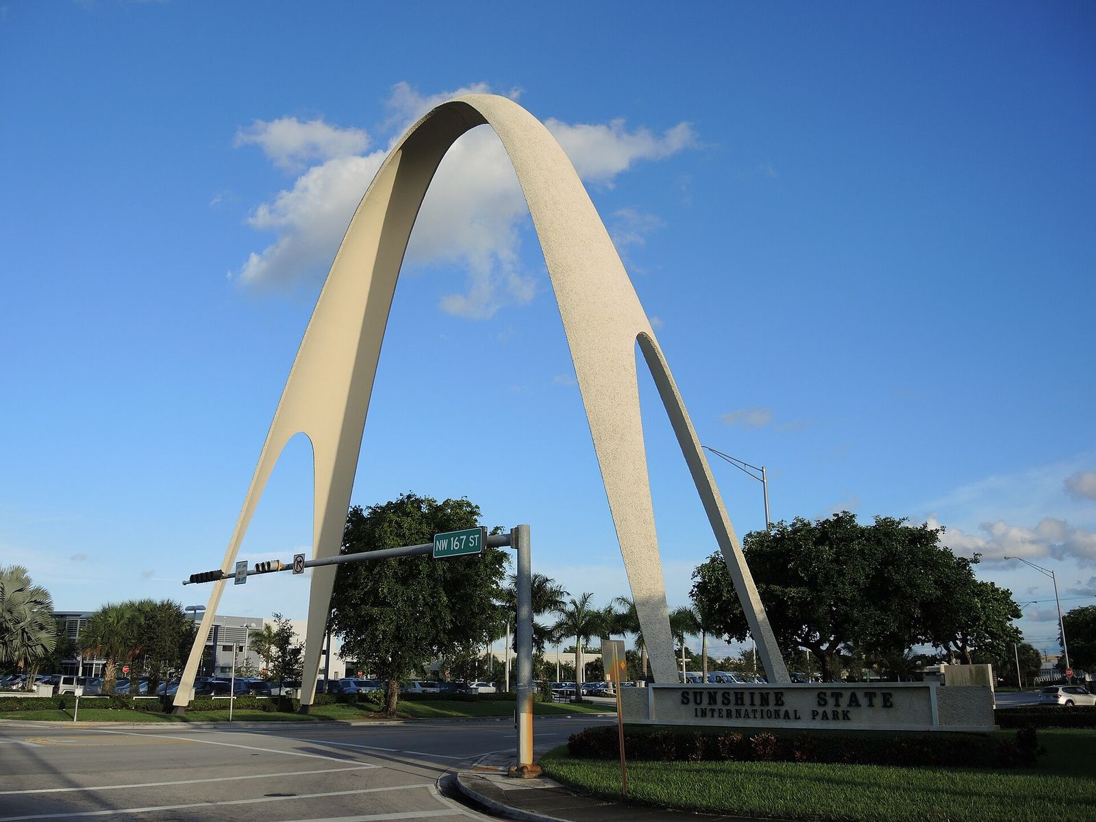 The white Sunshine State Arch spanning a road in Miami Gardens