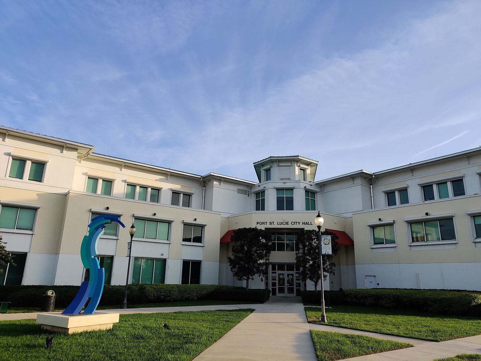 Port St. Lucie City Hall with a blue sculpture in front
