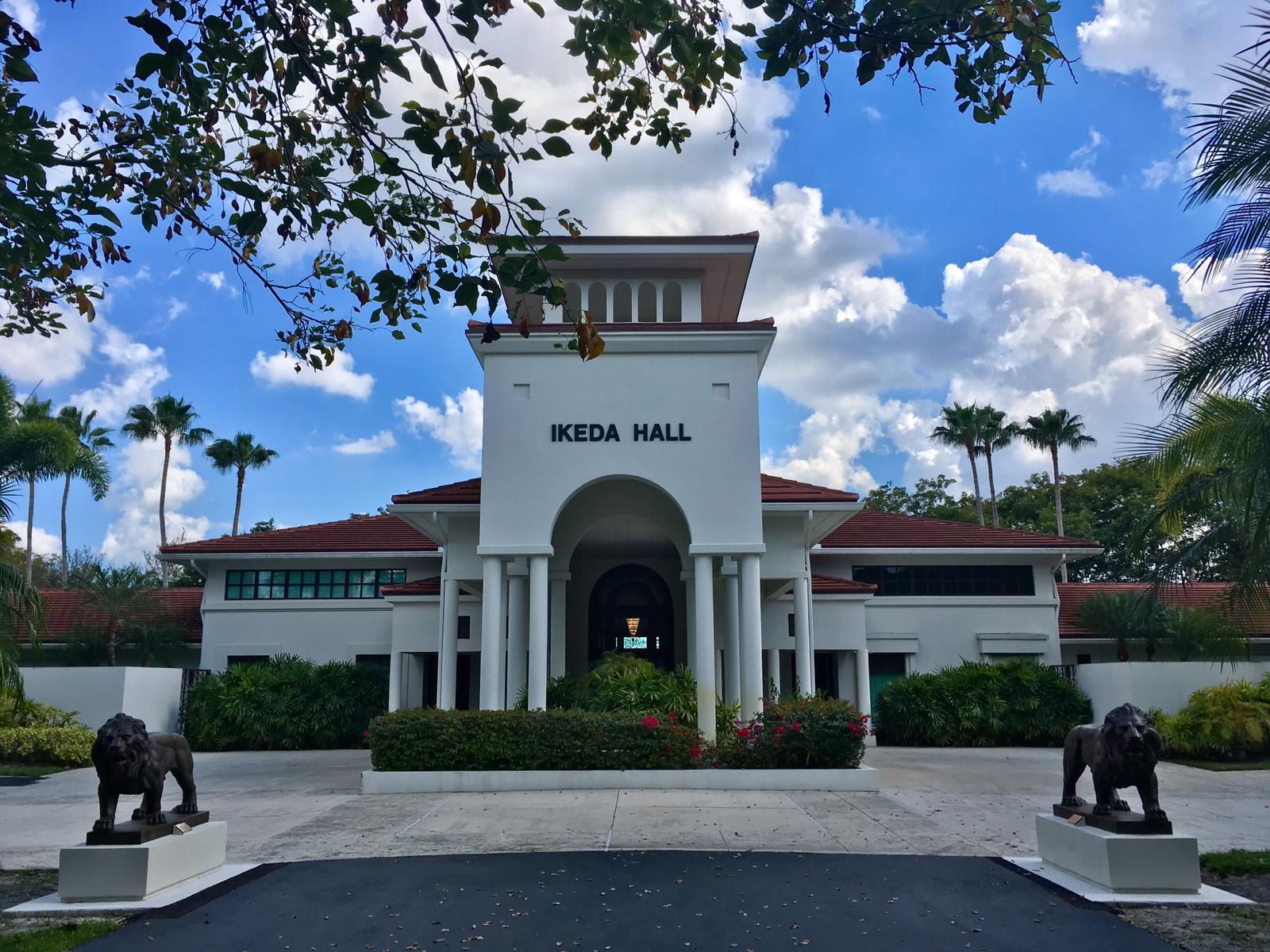 Ikeda Hall at the Florida Nature and Culture Center in Weston, a white tower entrance flanked by two lion statues