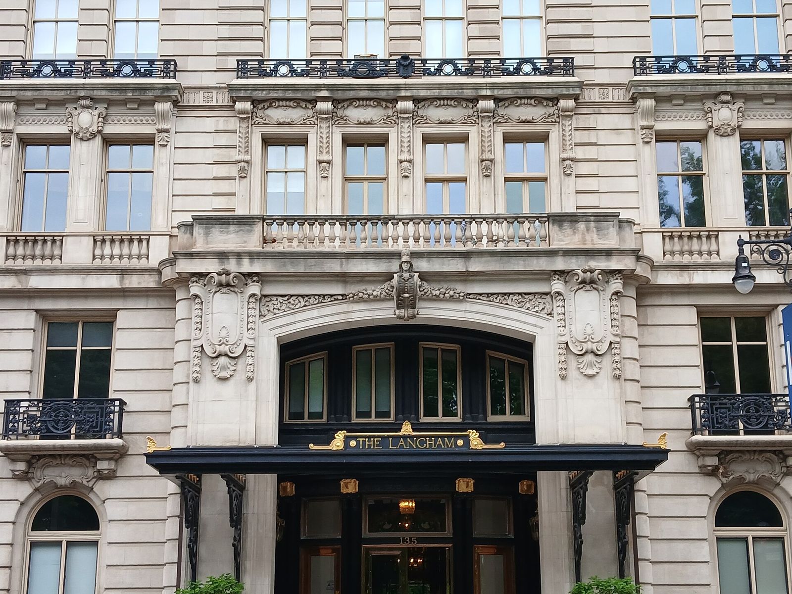 The Langham, an apartment building on the Upper West Side of Manhattan, with a dark canopy over its arched entrance