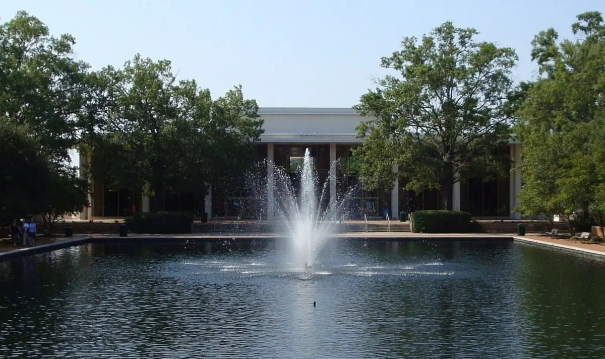 The Thomas Cooper Library at the University of South Carolina, behind a fountain in its reflecting pool
