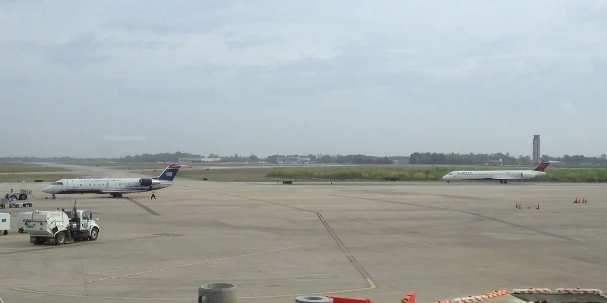 The airfield at Charleston International Airport seen from the passenger terminal, with parked aircraft on the apron