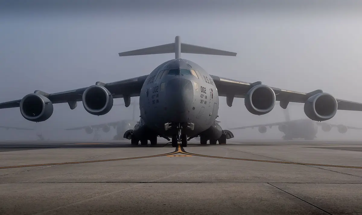 A C-17 Globemaster III parked on the flightline at Joint Base Charleston on a hazy morning