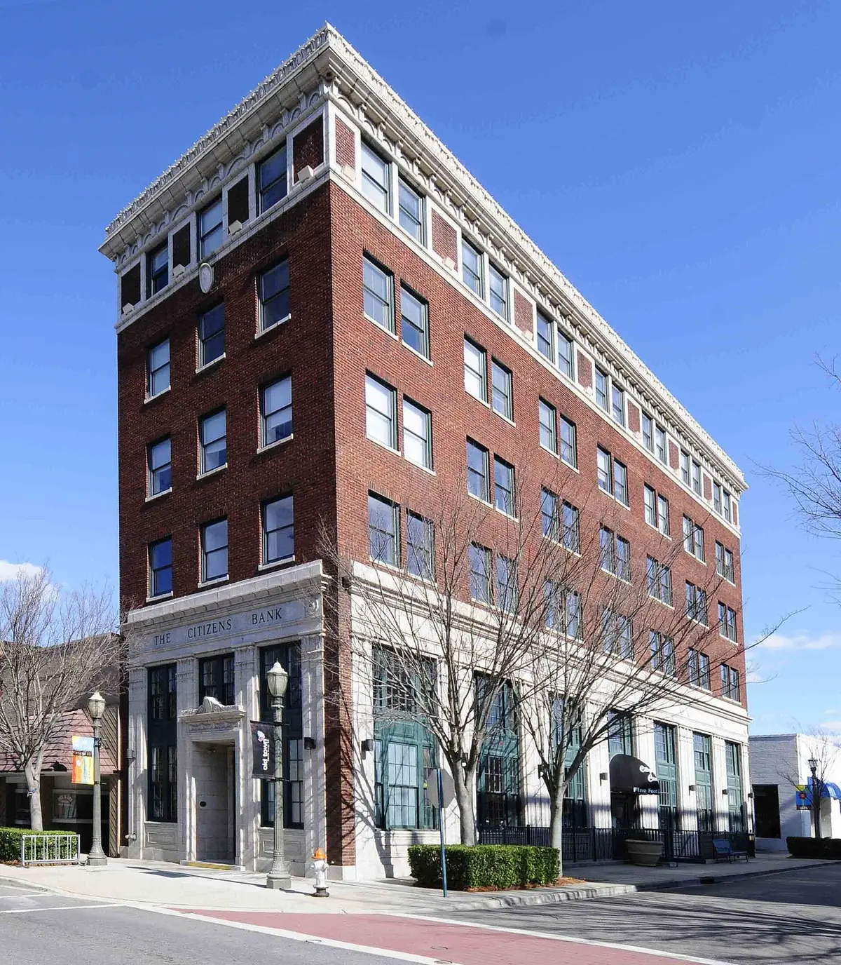 A tall brick building in the Rock Hill Downtown Historic District under a clear sky