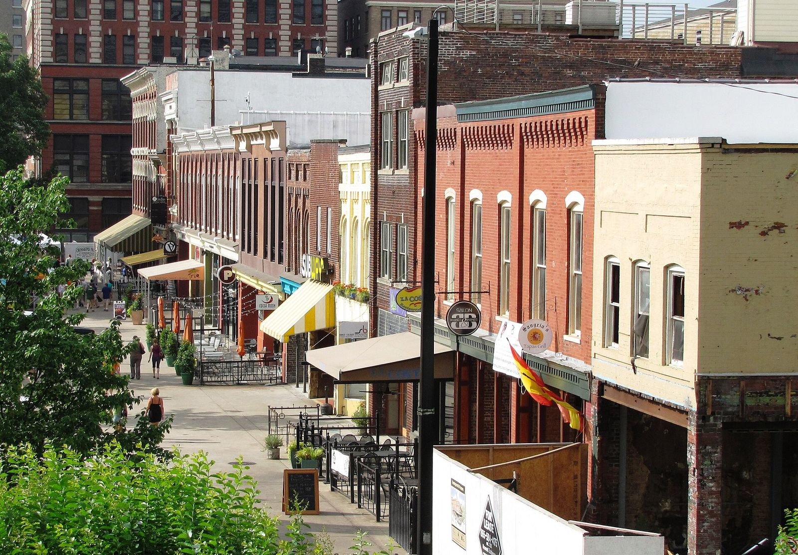 Brick storefronts and trees on Market Square in downtown Knoxville