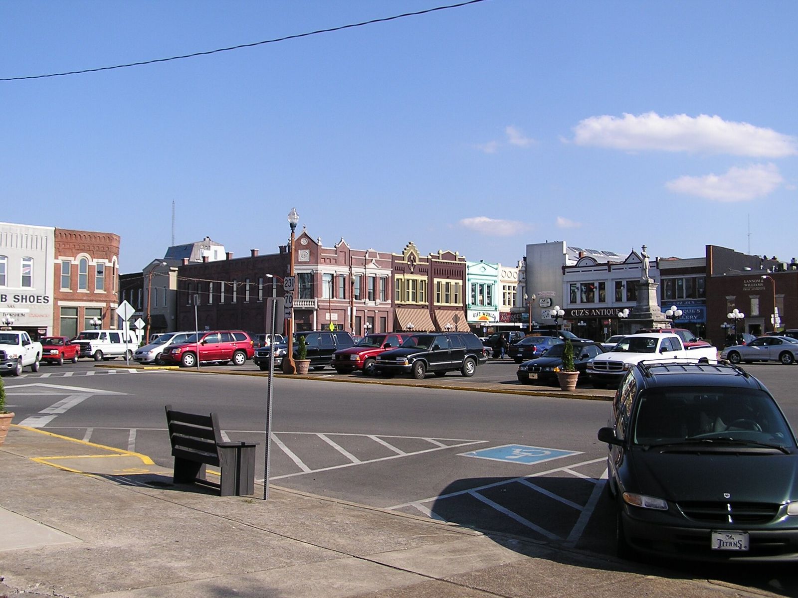 Storefronts and parked cars around the public square in downtown Lebanon
