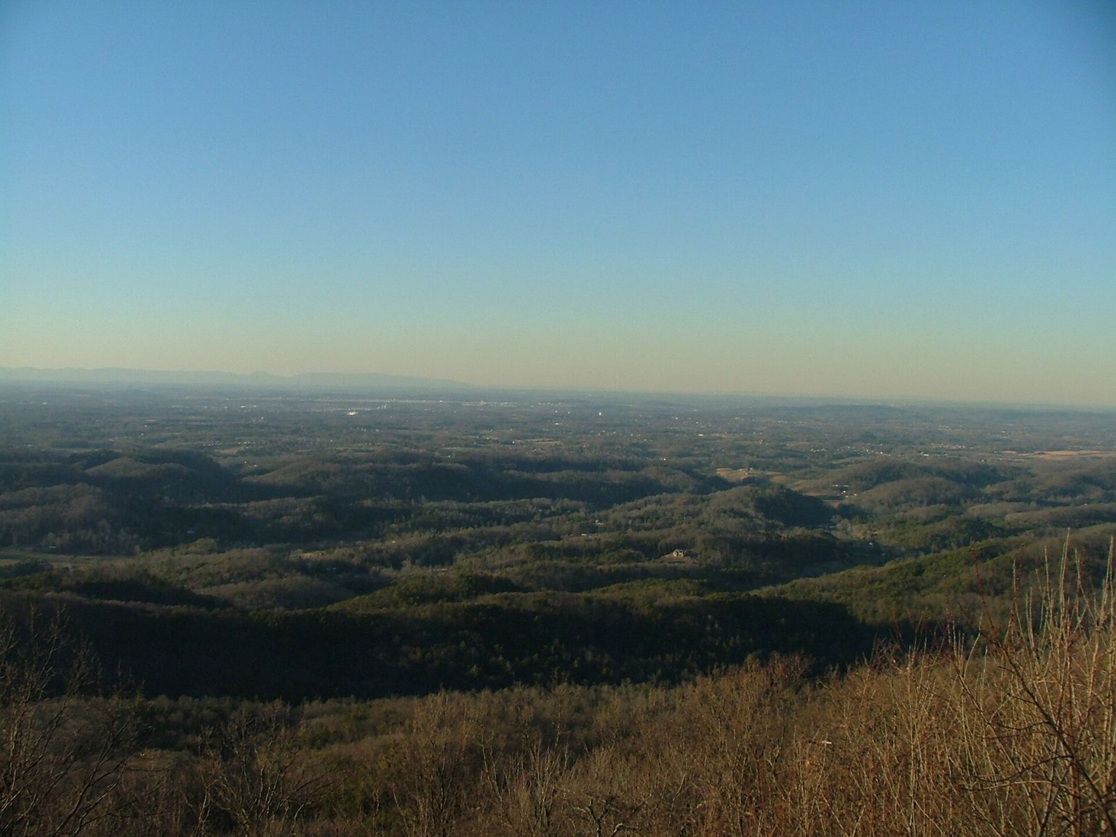 A hazy evening view across the valley from Chilhowee Mountain