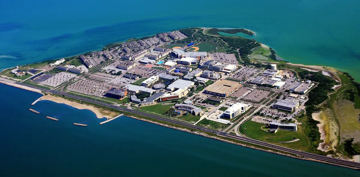 An aerial view of the Texas A&M University-Corpus Christi campus on Ward Island, with water on every side