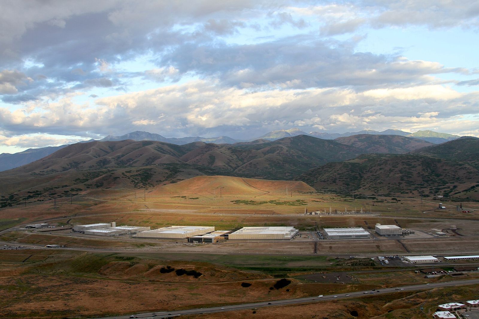 An aerial view of the large low buildings of the Utah Data Center in Bluffdale