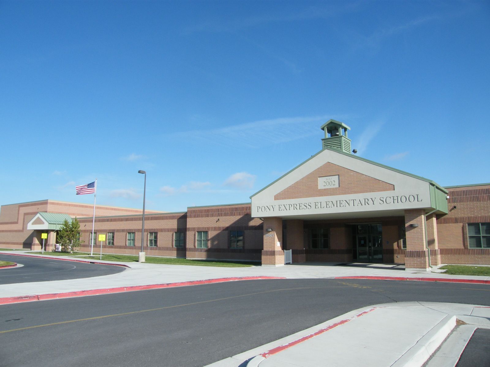 Pony Express Elementary School in Eagle Mountain under a clear blue sky