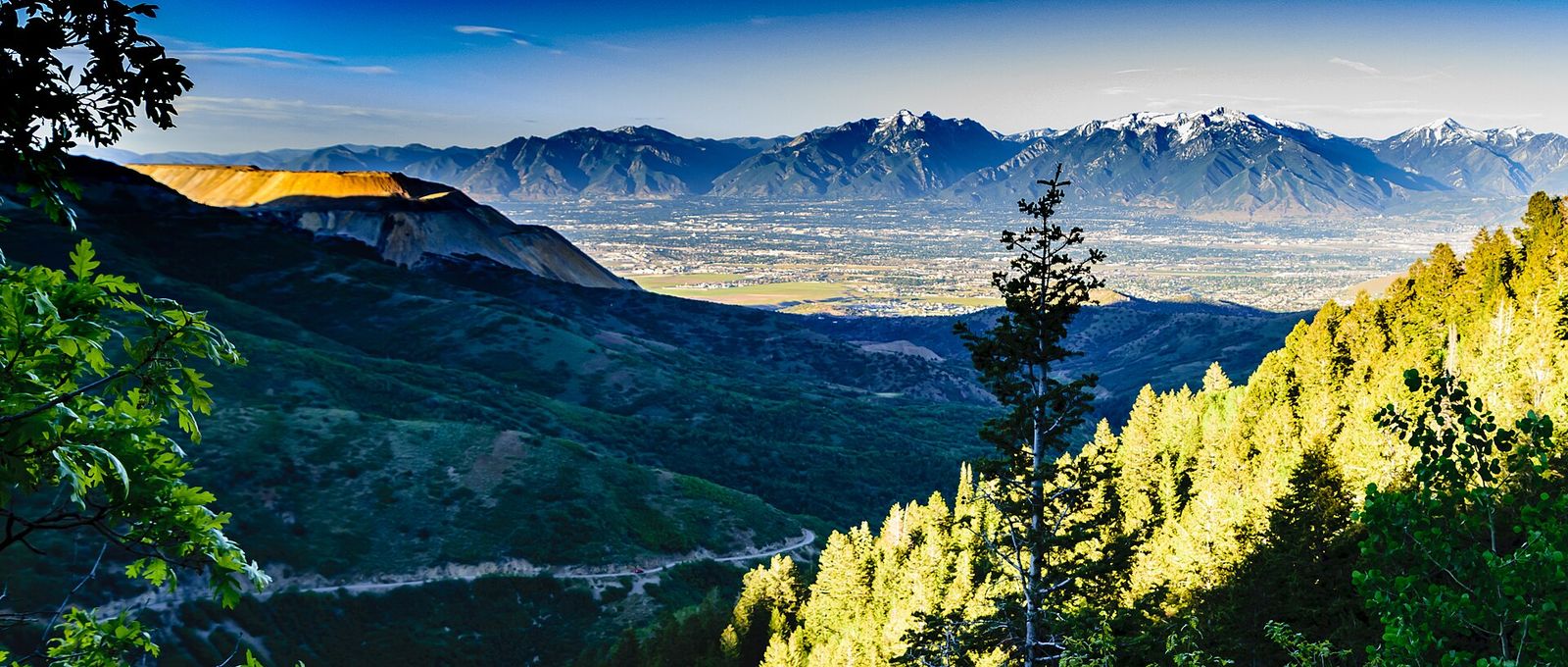 Looking down Butterfield Canyon toward the valley at sunrise, with mountains on the horizon