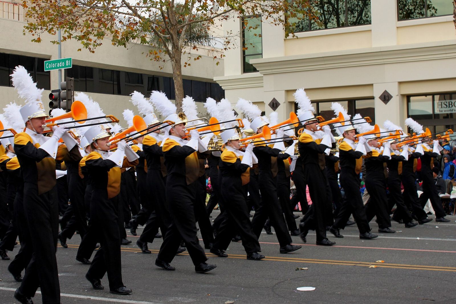 The Davis High School marching band from Kaysville in black and gold uniforms, marching in the 2013 Rose Parade in Pasadena