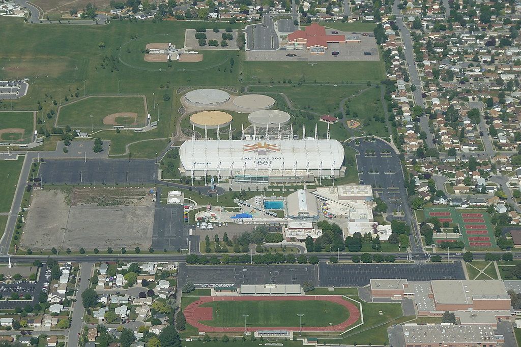 An aerial view of the Utah Olympic Oval and the sports fields of Oquirrh Park in Kearns