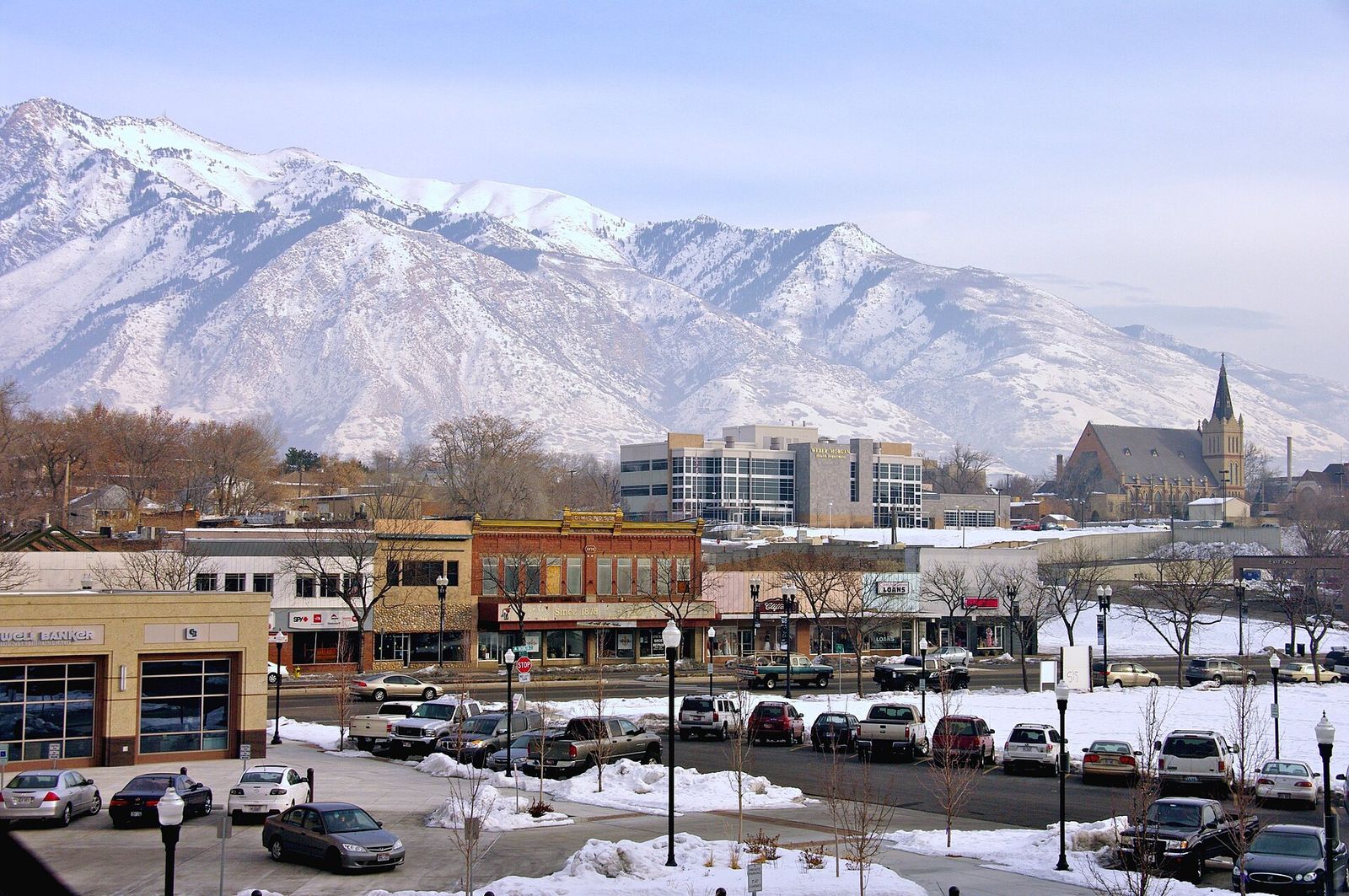 Downtown Ogden in winter, with snow on the ground and on the Wasatch peaks behind