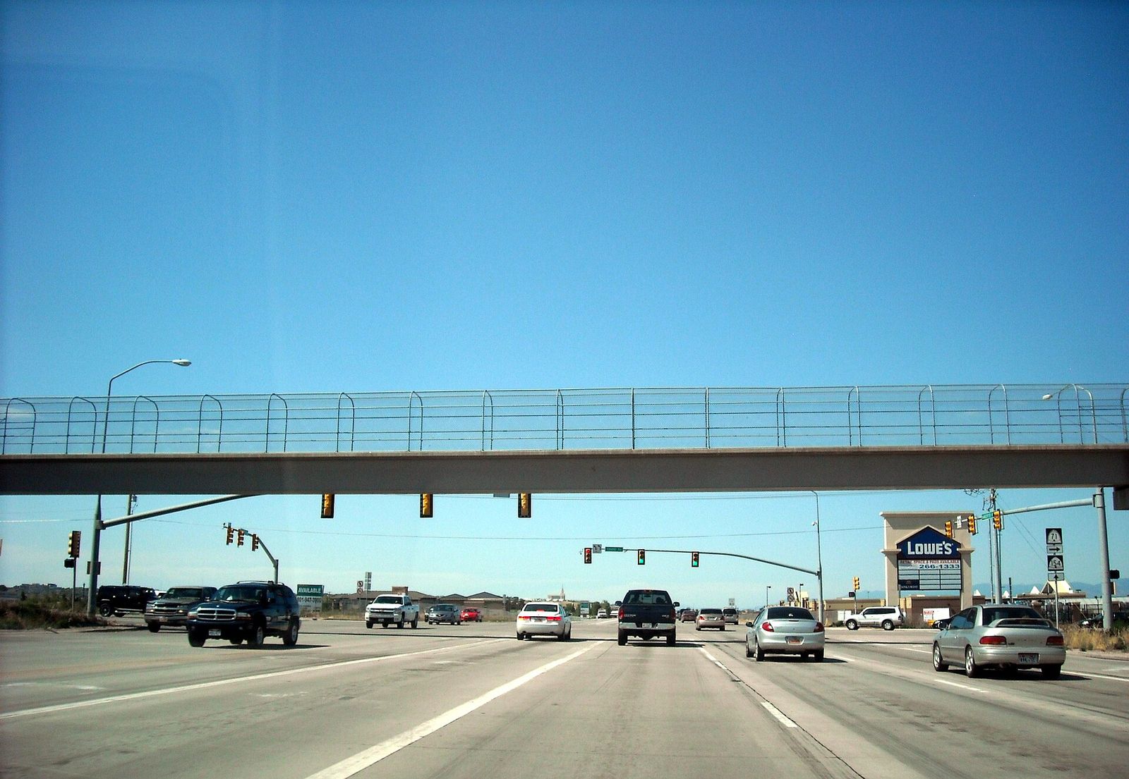 Traffic on Bangerter Highway at 12600 South in Riverton under a pedestrian bridge