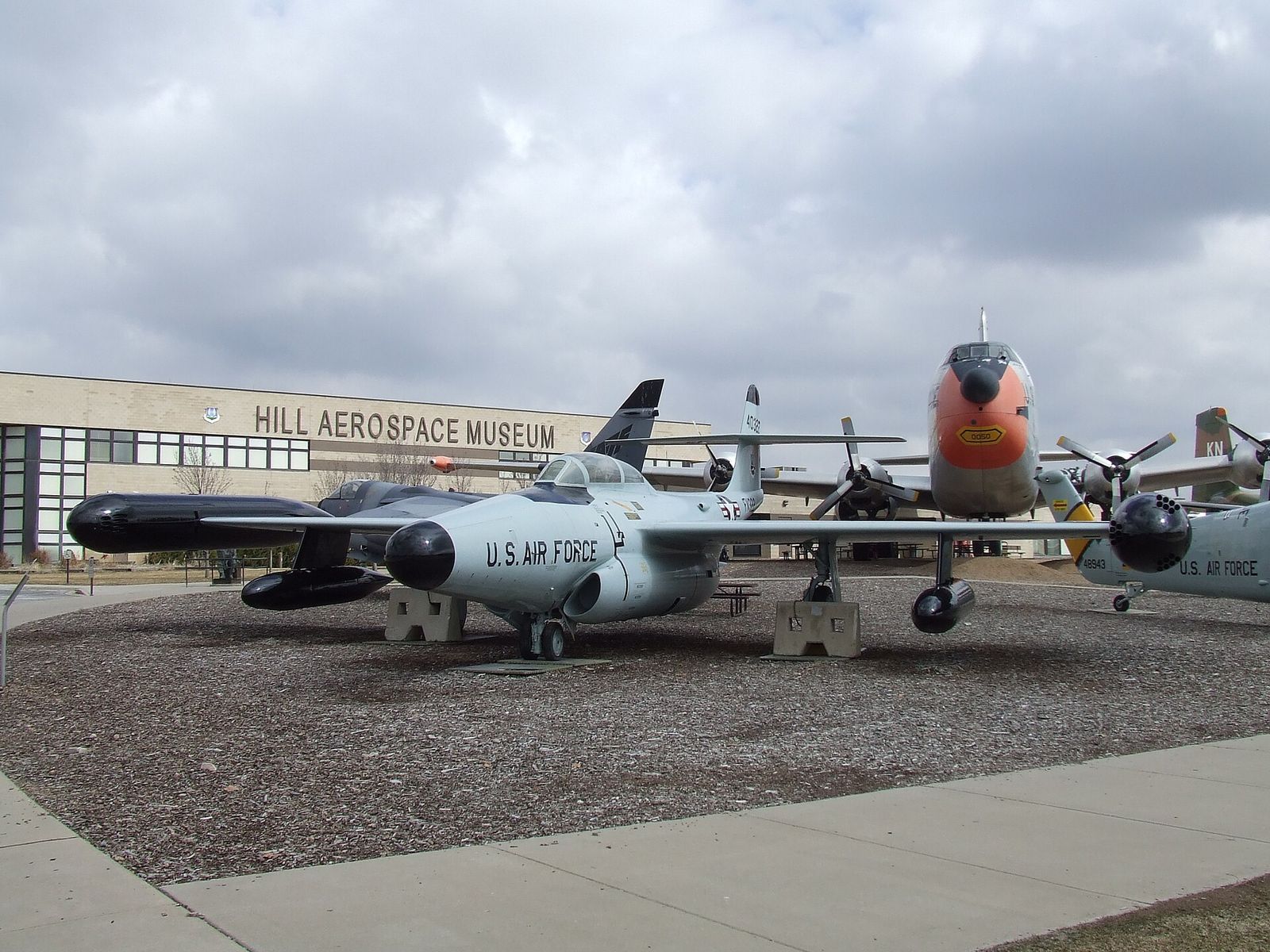 Jet aircraft on display outside the Hill Aerospace Museum building