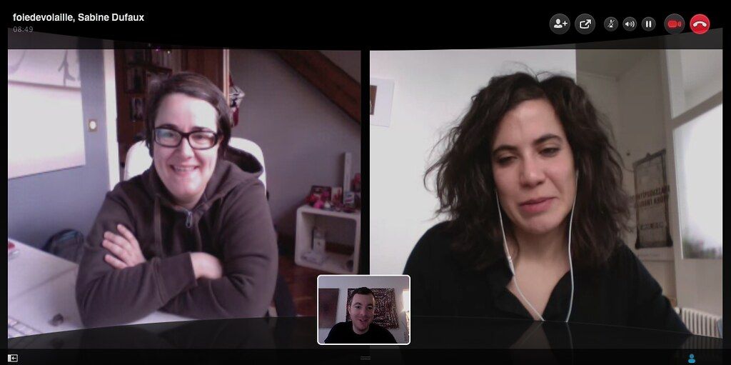 Laptop screen showing a two-person video call