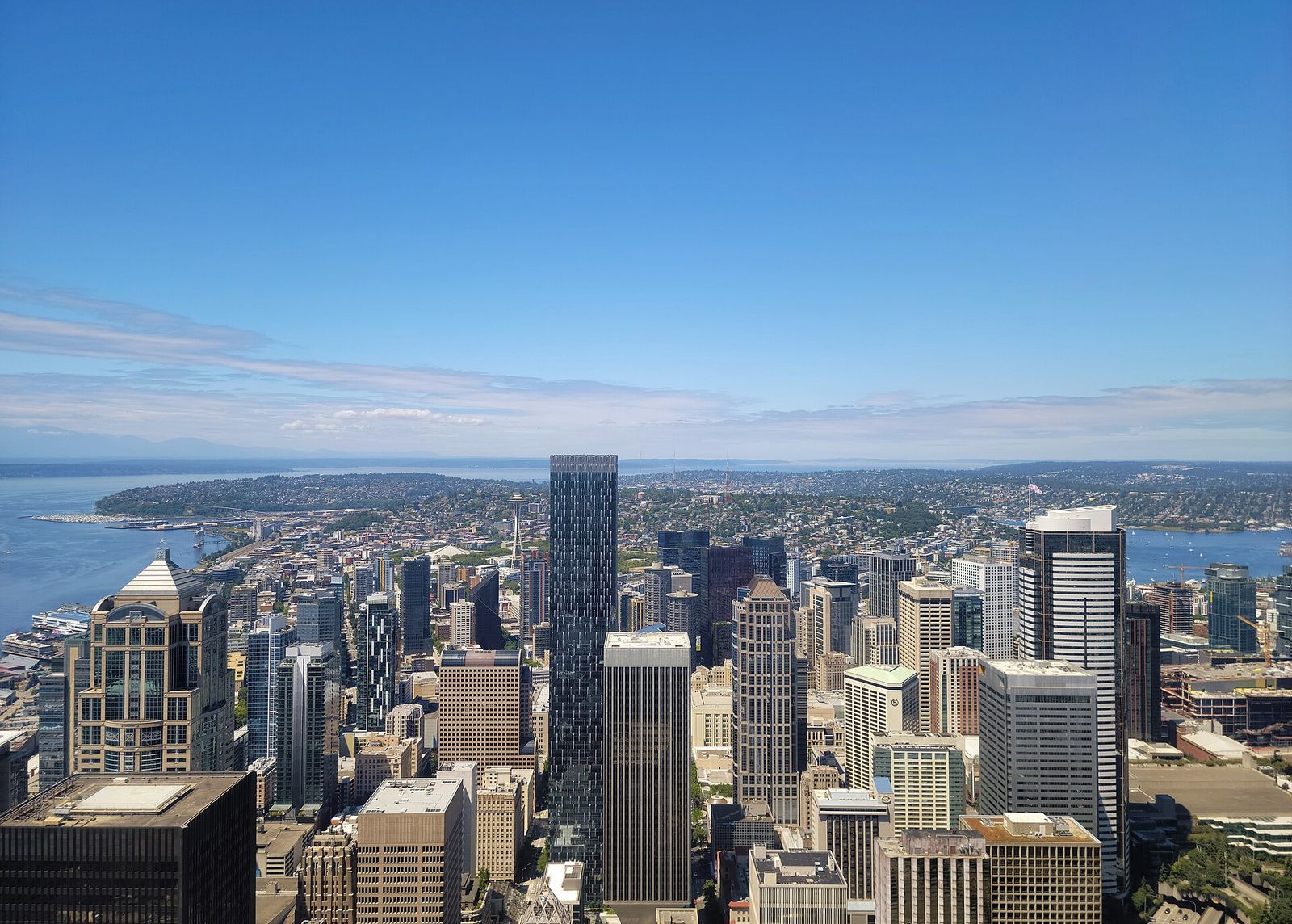 Downtown Seattle towers seen from high above, with Elliott Bay beyond